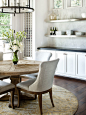 Example of a mountain style dining room design in Austin with dark wood floors and brown floors