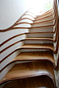 Trippy Stairs  Designed by Atmos Studio as part of a larger project, these stairs take on a curvy life of their own, twisting and turning, and generally looking fabulous.: 