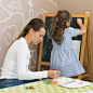 medium-shot-girl-drawing-chalkboard
