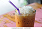 Thailand beverage, cold-milk-tea on painted desk. - stock photo