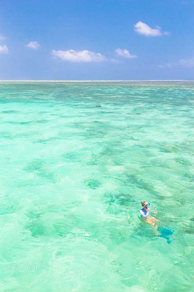 woman snorkeling in ...