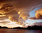 Absolutely spectacular shot of lenticular clouds over the Sandwich islands. Also known as altocumulus standing lenticularis, these are stationary, lens-shaped clouds that form at high altitudes. They are included in the middle layer cloud family because t