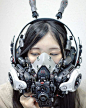 Modeler Hiroto Ikeuchi combines plastic model pieces and working electronics he modifies to create surreal works of art with awe-inspiring detail. His newest creation is this white face mask that features a futuristic cyberpunk design for a one-of-a-kind 