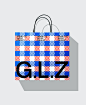This may contain: a blue and red shopping bag with the word gliz on it's front