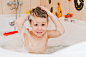 a child taking a bath with foam