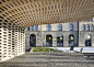 瑞士图书馆休闲木亭 Wooden pavilion by Ramser Schmid Architekten - 灵感日报 : 这座位于瑞士楚格州（Zug）市图书馆外的小凉亭看上去非常精巧别致，建筑由当地Ramser Schmid Architekten工作室设计，整个景观的下面是区域的地下车库及出入口。于是设计师巧妙地将景观与场地结合，创作出一个木块搭建的蘑菇小屋似的休息凉亭，可供访客休息观赏……