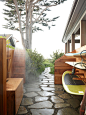 Inspiration for a beach style back patio in Santa Barbara with with an outdoor shower.