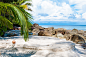 Beautiful tropical beach, with white sand, blue waters and colorful rocks by Constantin Stanciu on 500px