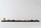 Artefact : PLAYThese beautiful objects promote play. The stones are designed to rest ergonomically within the palm of one's hand, and the interaction between the unique material combinations and form evoke visual and tactile intrigue. In a world dominated