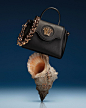Photo by Versace on May 15, 2021. May be an image of purse.