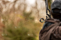 Archer takes aim with a hunting compound bow