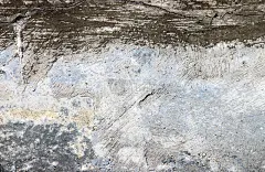 墙上留下了岁月的痕迹。旧混凝土的背景。褪了色的墙壁。抽象的纹理。