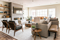 Family room - large traditional open concept medium tone wood floor and brown floor family room idea in Salt Lake City with beige walls, a ribbon fireplace and a wall-mounted tv