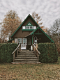 brown and green painted house