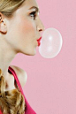 girl blowing bubble gum 