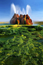 Nevada's Fly Geyser. Accidentally created in 1916 during well drilling, the geyser started spewing water in the 1960s when a geothermally heated pack of water found a weak spot in the wall and began escaping. Dissolved minerals rose and accumulated creati