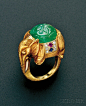 18KT GOLD, CARVED EMERALD, AND GEM-SET ELEPHANT RING, CARTIER. SET WITH A CARVED EMERALD CABOCHON, FANCY-CUT RUBY AND SAPPHIRES