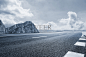 asphalt road and mountain under the blue sky