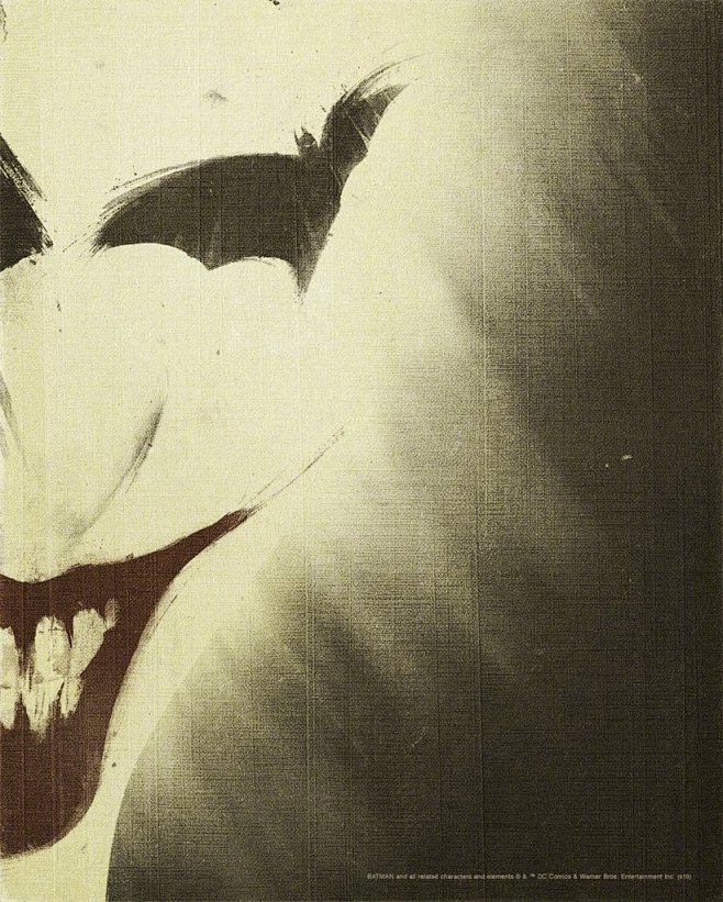 小丑邪魅一笑，眼睛处是展翅的蝙蝠侠。