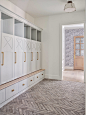 Example of a large country brick floor mudroom design in Phoenix with white walls