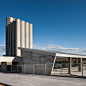 Concrete canopy shelters bus station by Ismo Arquitectura : A cluster of concrete animal-feed silos loom over this bus station in Spain, designed by Ismo Arquitectura to improve transport links to a fortified town
