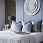 The cool tones in this guest bedroom make for a very relaxed atmosphere