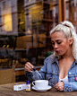 Woman in Blue Denim Jacket Holding Dropper