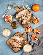 Traditional Italian style home breakfast. Latte in glasses, almond croissants on rustic wooden...