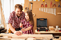 Father with his cute little daughter in woodshop.