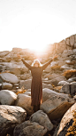 Women with outstretched arms enjoying the wind