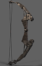 This may contain: an old metal bow that is being used for archery