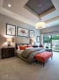 Love the Master Bedroom Color with the touch of orange and the Pics above Bed.