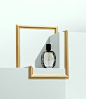This may contain: a bottle of perfume sitting on top of a shelf