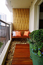 Bamboo inspired walls aren’t only great to look at but they also help make your surroundings seem fresh and cool. Add smooth white pebbles as your carpet and potted plants and you will be feeling the cool fresh air blowing straight from your balcony.