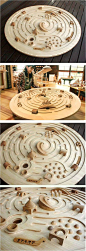 Large Swivelling Wooden Labyrinth by Ginga Kobo Toys, Japan - An immense spaceship labyrinth with a diameter of 120cm. The marblesque 3 cm. large glass balls roll around circling towards the center. Aim for the chute which leads into the mouth of the volc