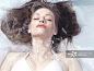 Natural look beauty portrait of a young woman lying relaxed in water with closed eyes Beauty treatment concept
