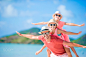Father and kids enjoying beach summer tropical vacation