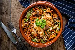 Fried chicken fillet with vegetables.Fried chicken fillet with vegetables. Dark light.