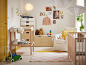 Fresh white, wood and yellow nursery with cot, changing table and storage. 