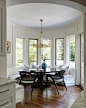 Inspiration for a large transitional medium tone wood floor, brown floor and wall paneling breakfast nook remodel in Chicago with white walls and no fireplace