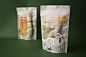 Packaging │急食速麵 Taiwan Flour Vermicelli : 急食速麵使用臺中大甲地區所生產的臺中選二號小麥，搭配歐式石磨製粉，在麵線上也能清楚看見製程中留下的麥子麩皮，讓麥香看得見也吃得到，因此在包裝上採用白棉袋，讓麵線的形象若隱若現，並大面積的繪出產地大甲的面貌，大安溪映著鐵砧山，保護著小麥不受鳥害的趕鳥球在沖積平原上搖曳著，成為整個圖面的小亮點。在特殊節日或活動時，包裝正面還能加上一片腰封，使用撕斷線的設計，將所要附贈的食譜、資訊等藏在裡頭，用設計凸顯臺灣農產加工品的特色氛圍。
