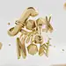 Maxon Cinema 4D tutorial: Create realistic gold 3D type : Peter Tarka combines hand-made lettering with customised fonts