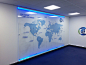 A multi-layered office graphic with contour cut vinyl map applied to the wall and plotted detail applied to a 10mm acrylic, mounted on locators and with edge lit LED extrusions to top and bottom_
