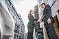 Caucasian business people shaking hands outdoors by Gable Denims on 500px