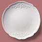 High Angle View Of White Plate On Peach Background