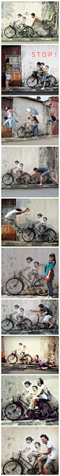 马来西亚槟城的某街道小巷内，一幅绘制于墙面上的普通绘画：姐弟俩欢快地骑自行车，配合一辆真实的自行车道具，吸引了众多居民与路人前来参观，并争相摆出各种创意造型，于是就出现了下面一个个非常有趣、搞怪的场景，非常的有创意。