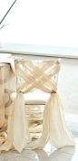 Draping fabric gives rented chairs a luxurious look.