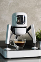 This may contain: a coffee maker sitting on top of a table