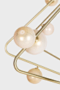 CB.29.01 in brushed brass with white mini-globes with 24k gold foilPhoto by Lauren Coleman