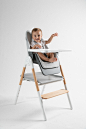 Sit-To-Step High Chair : Merging design with functionality, the Sit-to-Step High Chair was designed to fit into the environment of the home without compromising on useful features like reclining, and folding for storage. It starts as a feeding chair for c